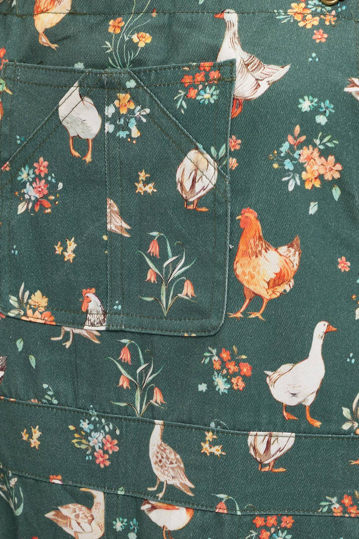 Fabric with chicken and duck pattern on a green background