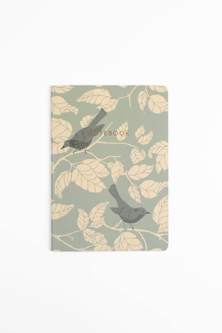 Notebook with bird and leaf design on a light green background