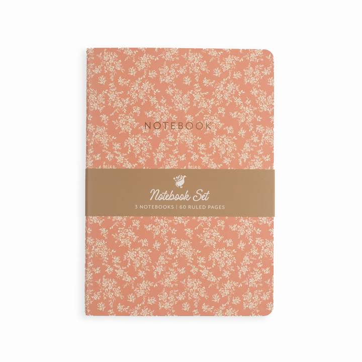 Notebook set with floral pattern and brown band on a white background