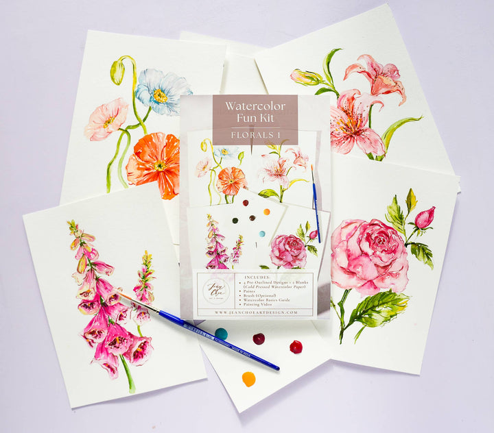 Watercolor Fun Kit with floral designs on paper and a paintbrush on a light purple background