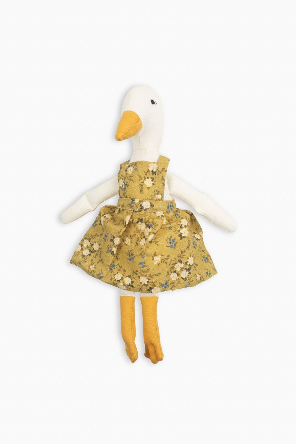 Stuffed toy goose wearing a yellow floral dress on a white background