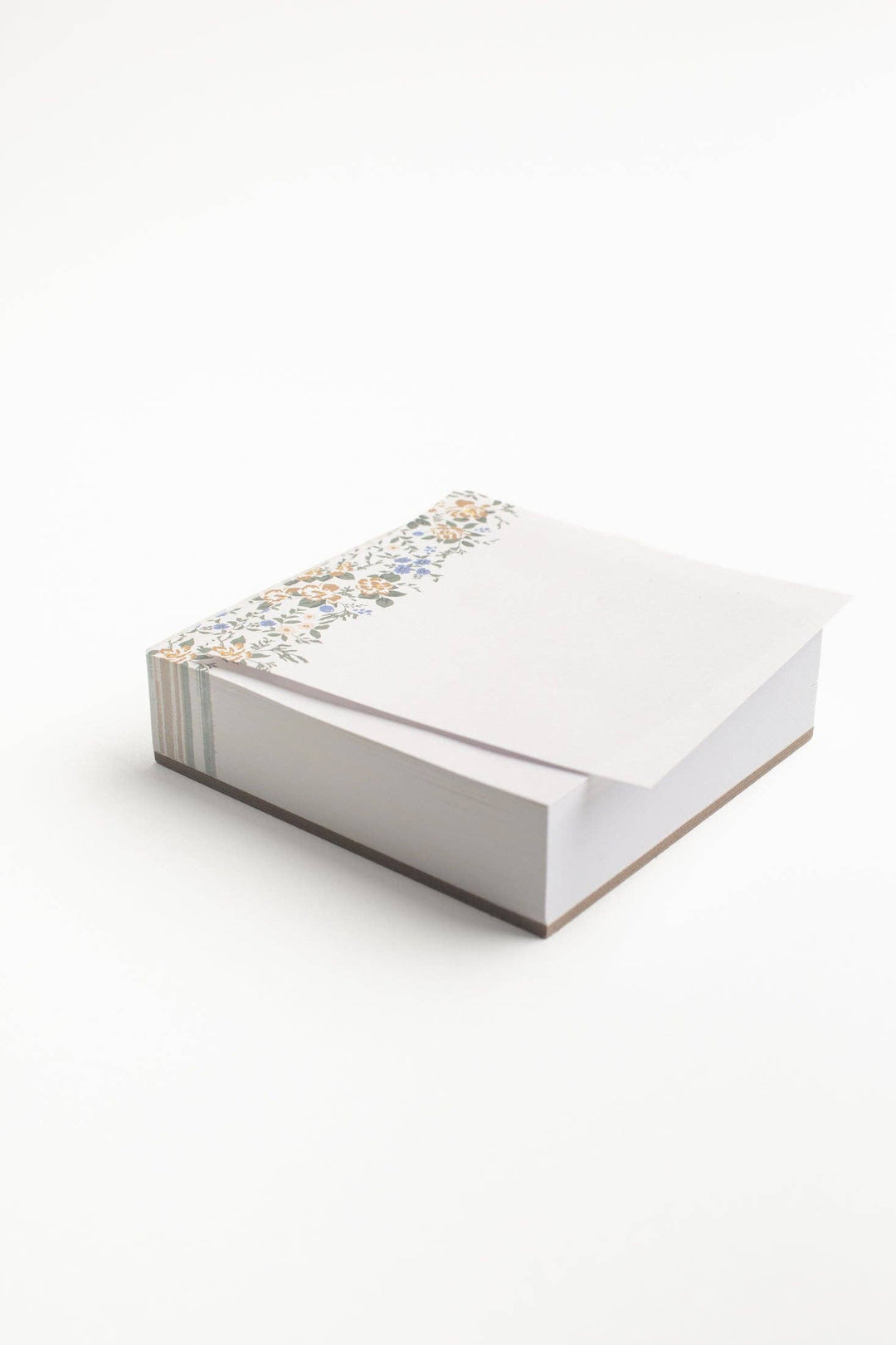 White notebook with decorative cover on a white background
