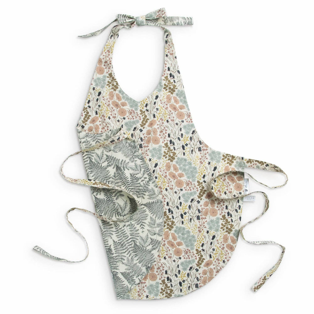 Reversible floral and fern patterned full apron on a white background