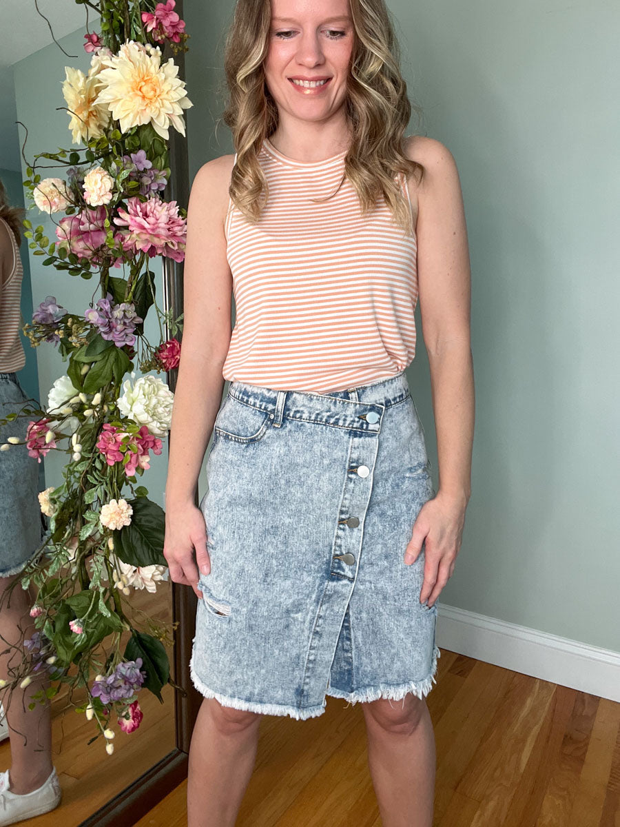 Light blue wash asymmetrical denim skirt with buttons