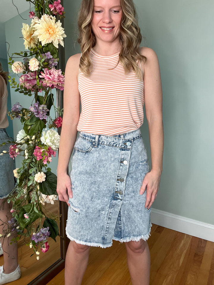 Light blue wash asymmetrical denim skirt with buttons