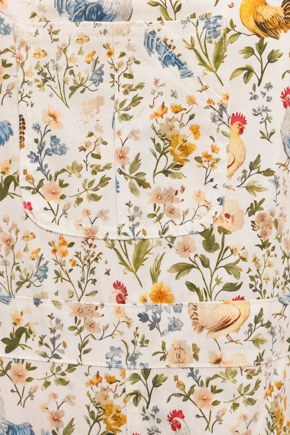 Floral and rooster patterned fabric with a white background