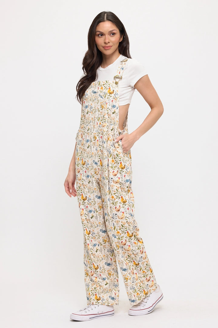 Woman wearing chicken and flower printed gardening overalls