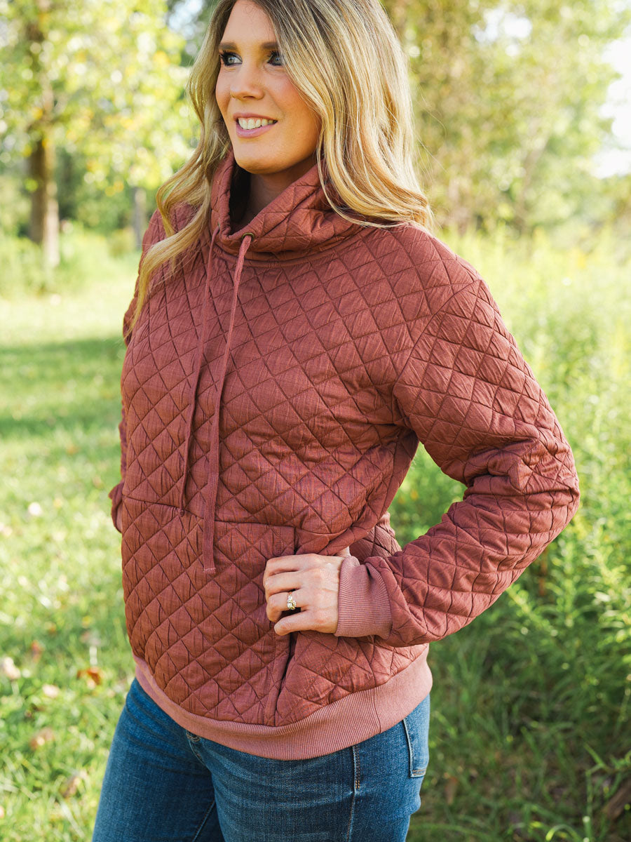 Quilted funnel neck pullover in rust