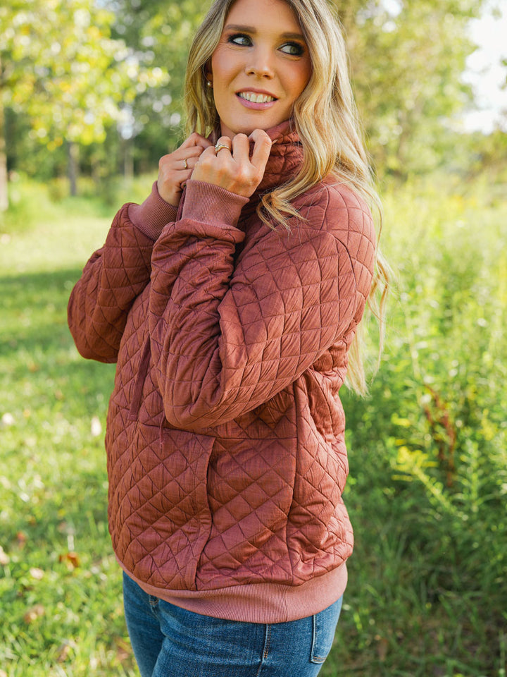 Quilted funnel neck pullover in rust