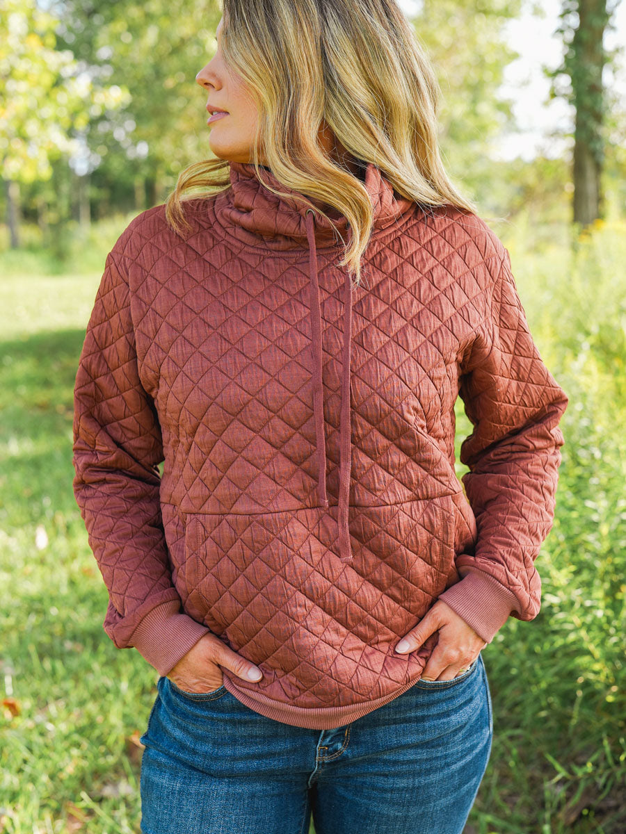 Quilted funnel neck pullover in rust