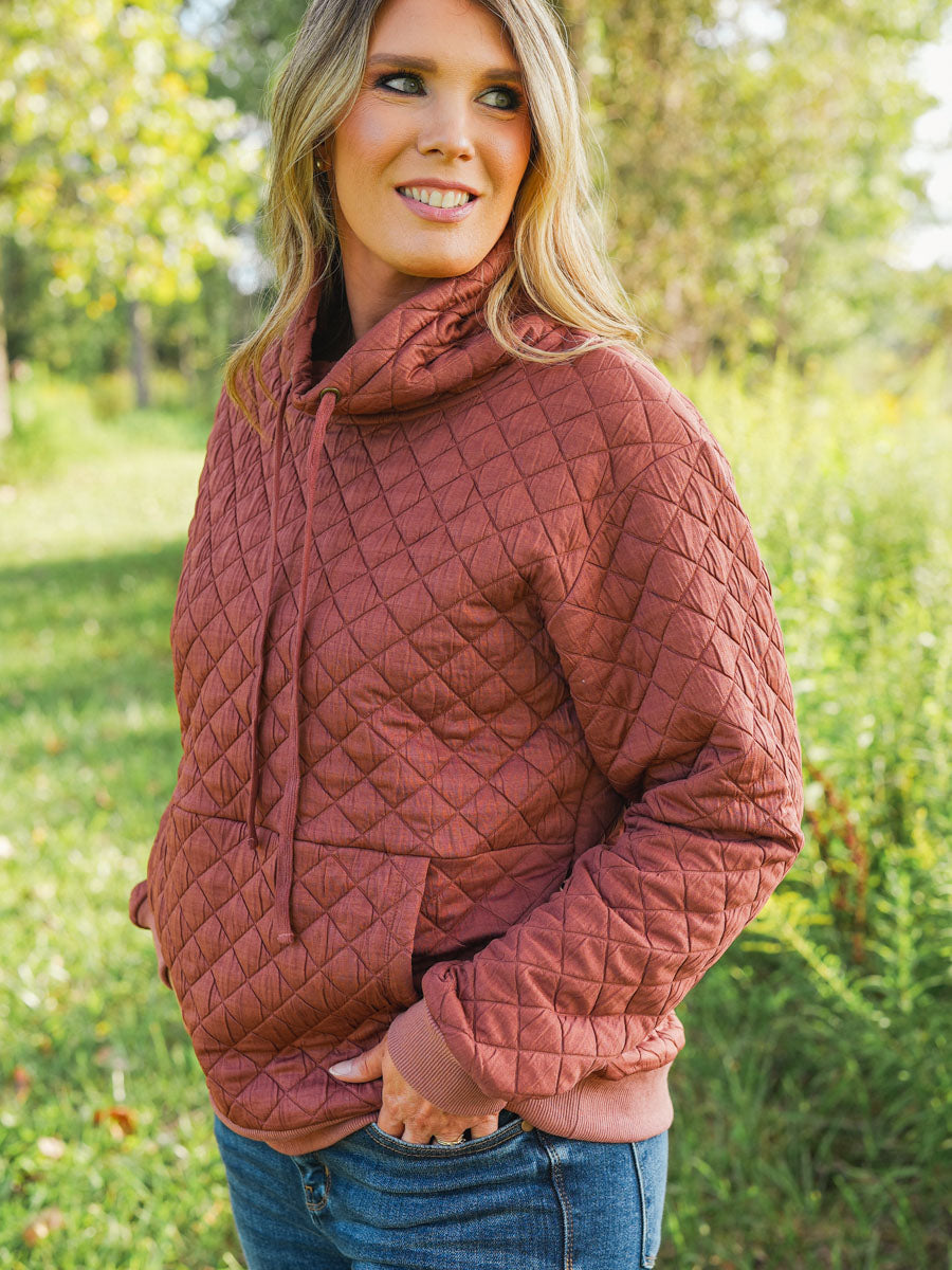 Quilted funnel neck pullover in rust