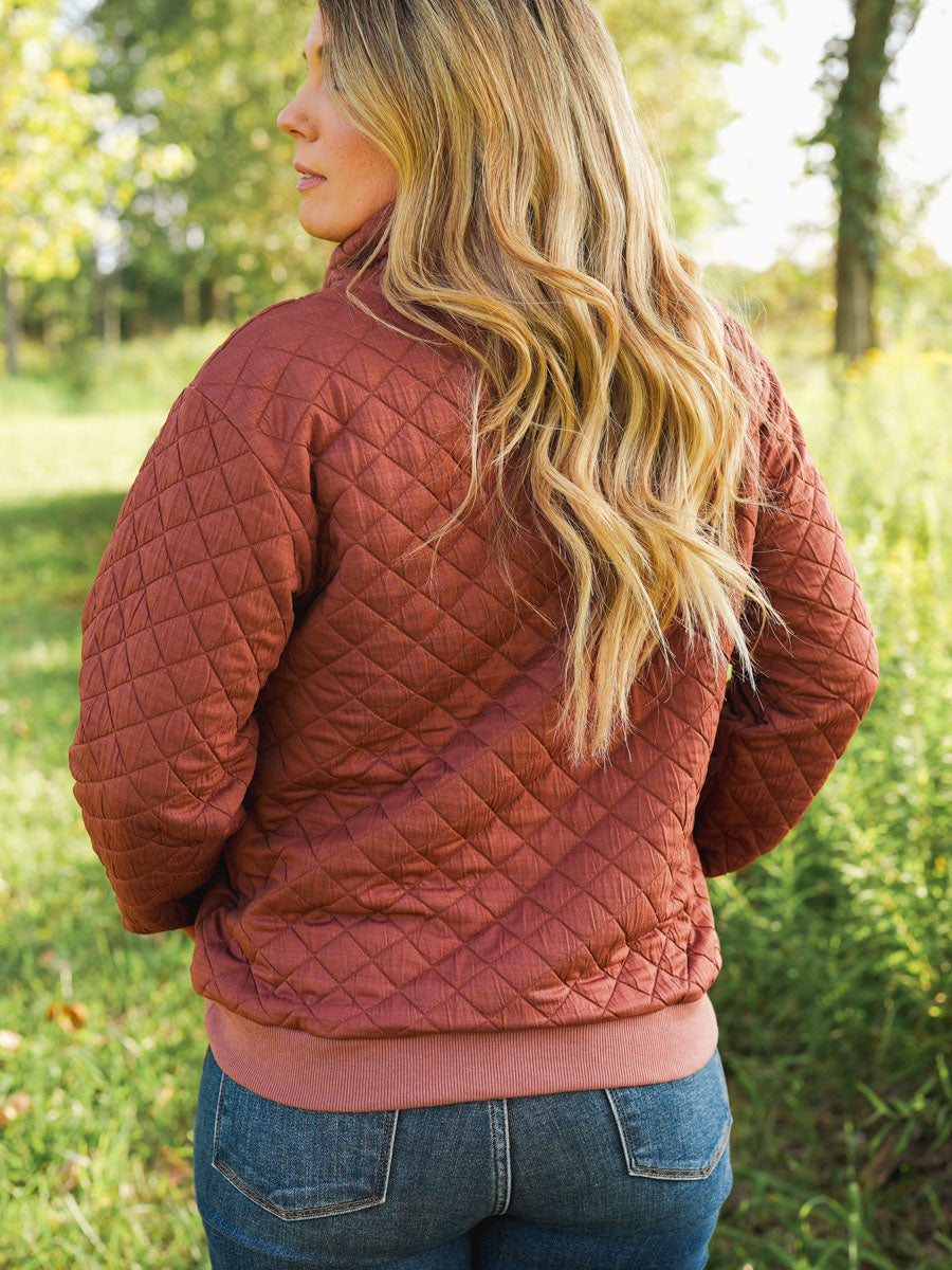 Quilted funnel neck pullover in rust