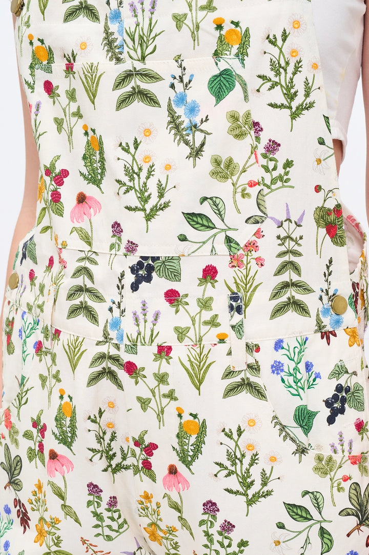 Close up of gardening overalls flower and berry print