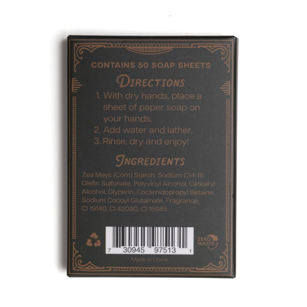 The back of a dark brown soap sheet package, showing directions and ingredients text in gold and light brown lettering, with a barcode at the bottom, photographed on a white background.