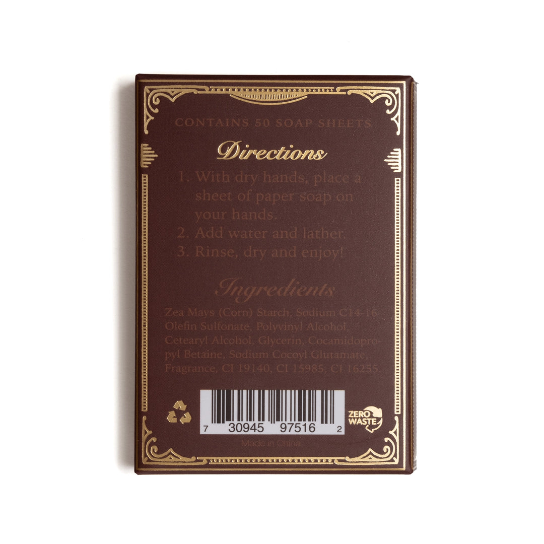 The back of a Zero Waste soap sheet pack, showing the brown backing card with gold decorative borders, usage instructions, ingredients list, and a barcode.