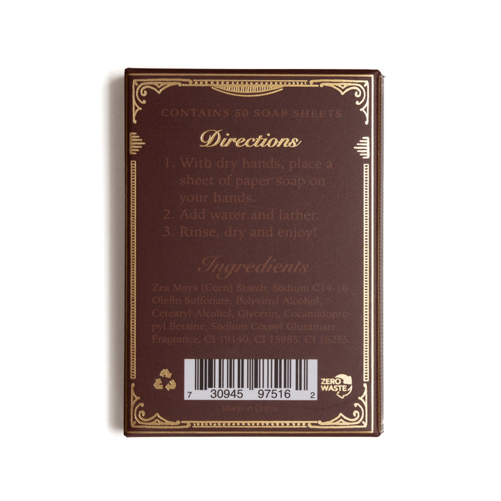 The back of a Zero Waste soap sheet pack, showing the brown backing card with gold decorative borders, usage instructions, ingredients list, and a barcode.
