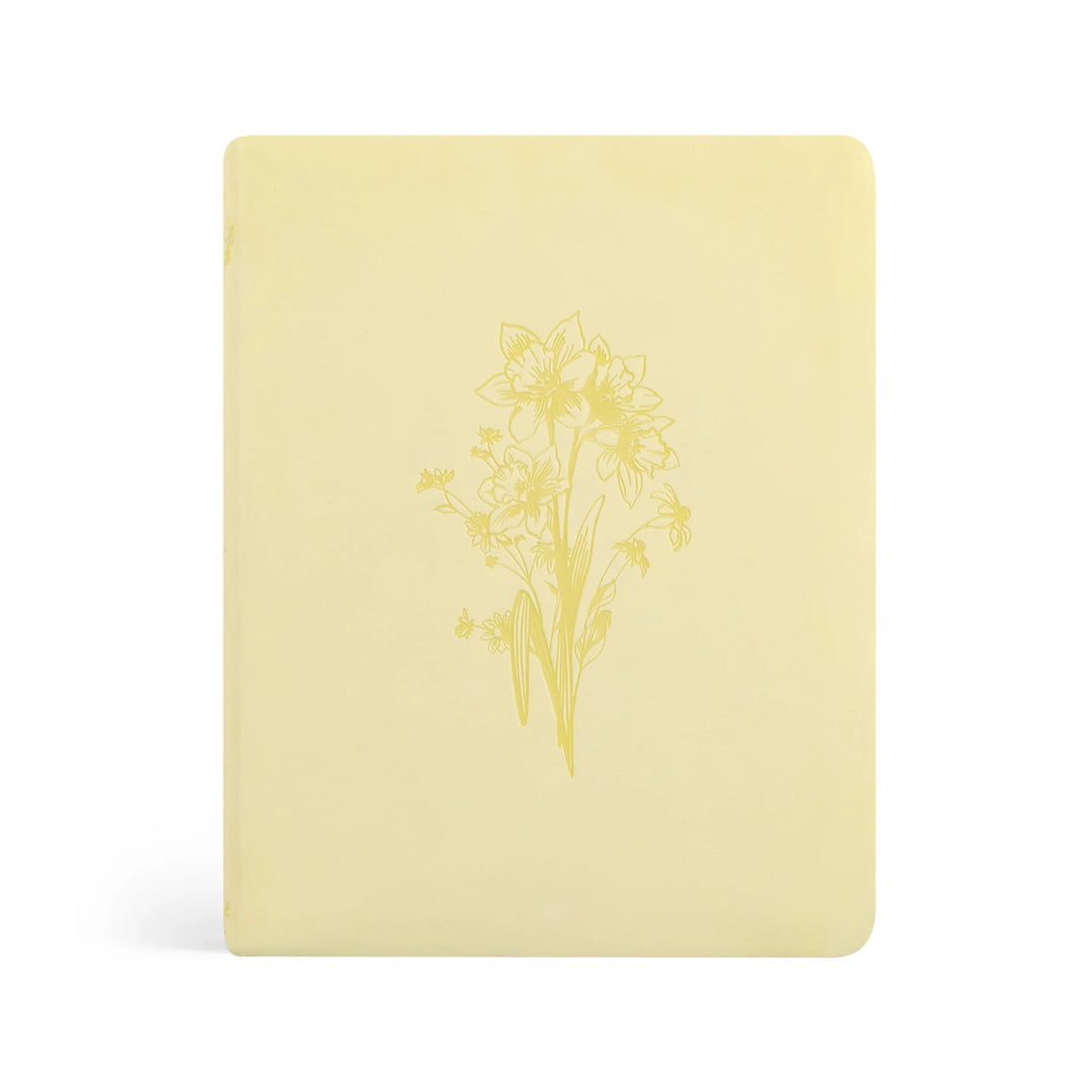 Beautiful Yellow Bible with a daffodil floral design on a white background
