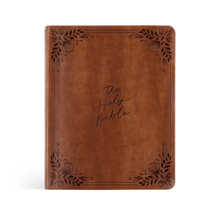 Brown leather Bible with floral designs on a white background