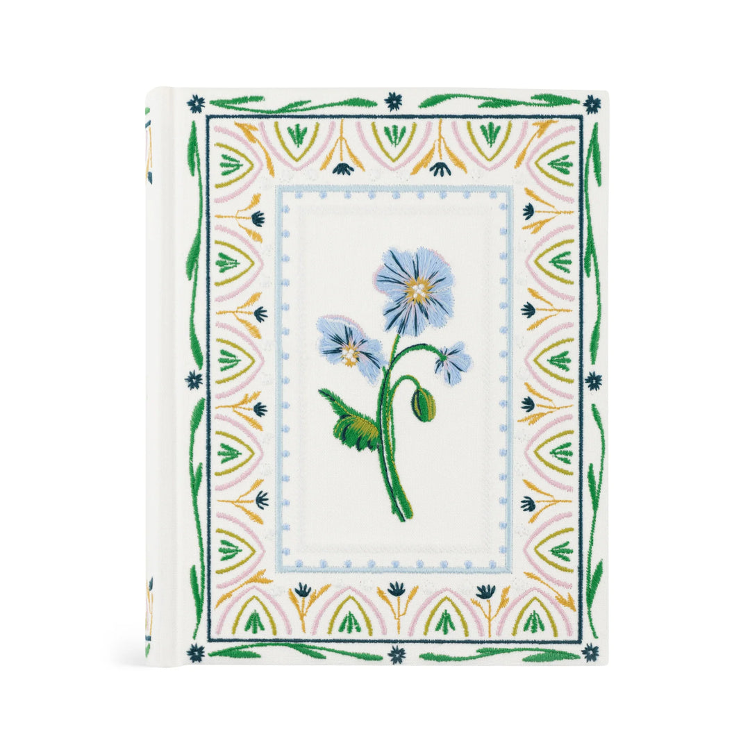 Floral embroidered Bible with geometric border on a white background