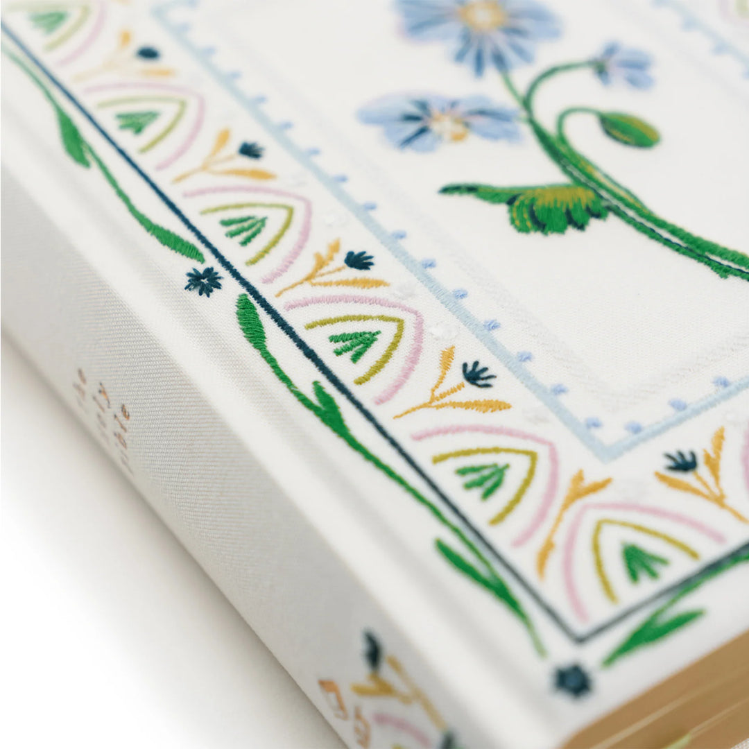 Close-up of Bible with embroidered flower and geometric patterns on the cover