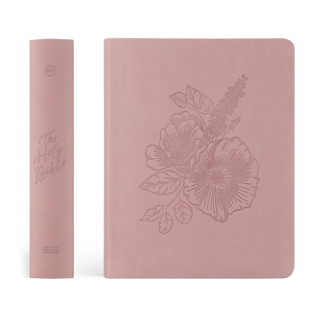 Pink Bible cover with floral design on a white background