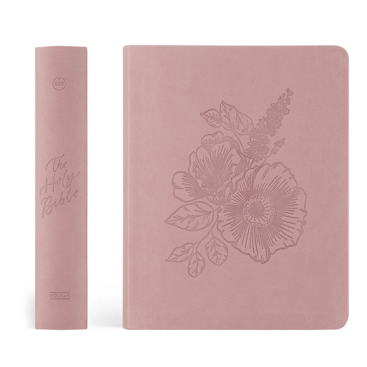 Pink Bible cover with floral design on a white background
