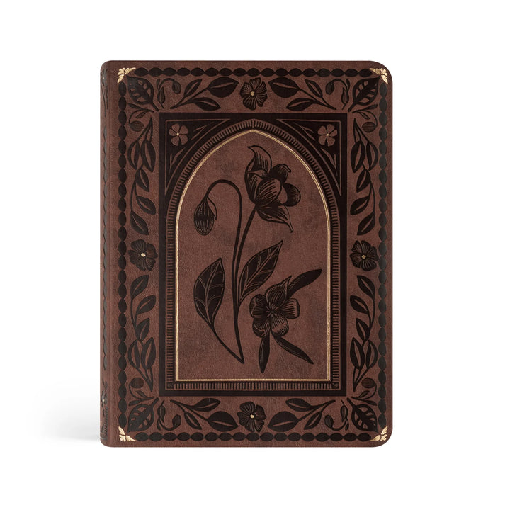 Decorative brown Bible with floral embossing on a white background