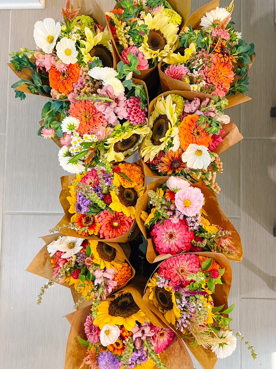 Buckets of colorful market bouquets for subscriptions