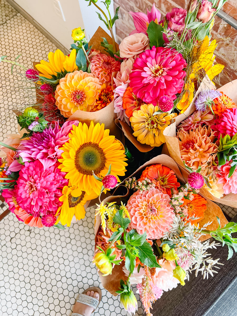 Colorful bouquet of flowers on a tiled floor