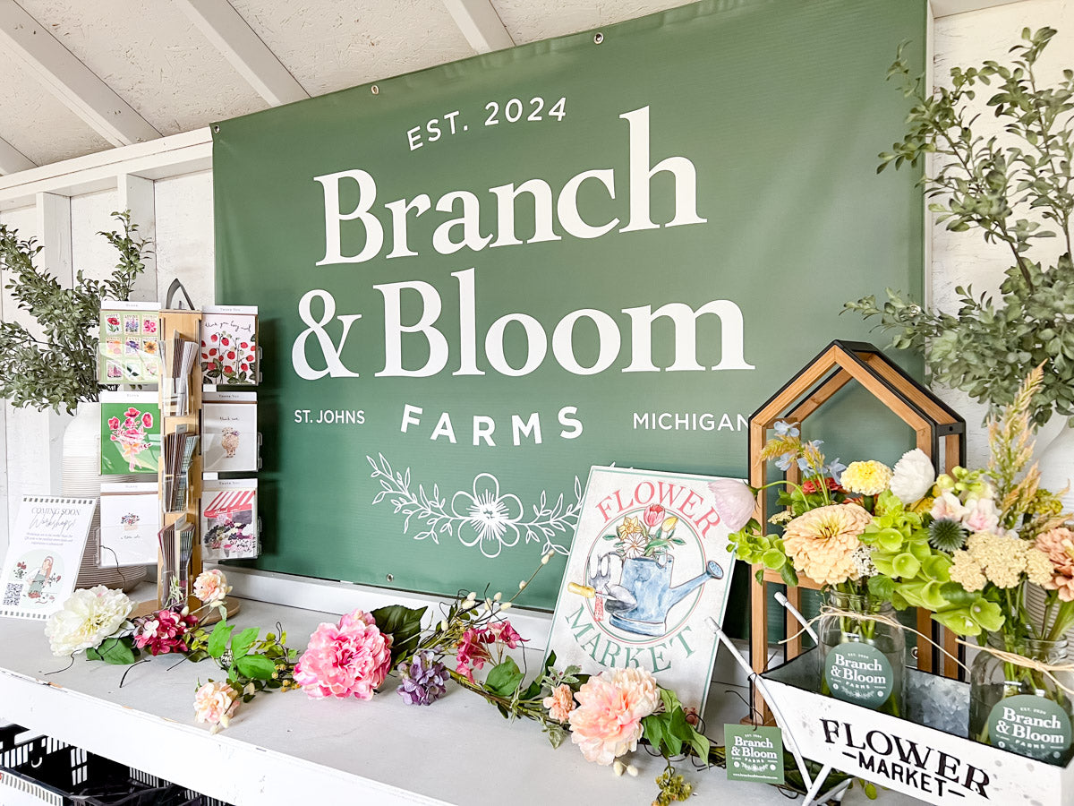 Branch and Bloom Farms banner hanging in farmstand interior in St. Johns, Michigan