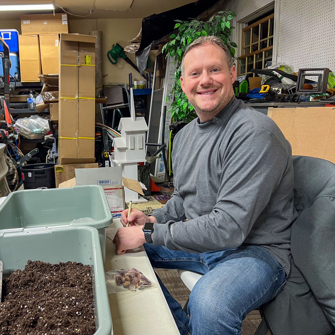 Jason Miller of Branch and Bloom Farms in St. Johns Michigan works on starting chestnut trees in his garage.