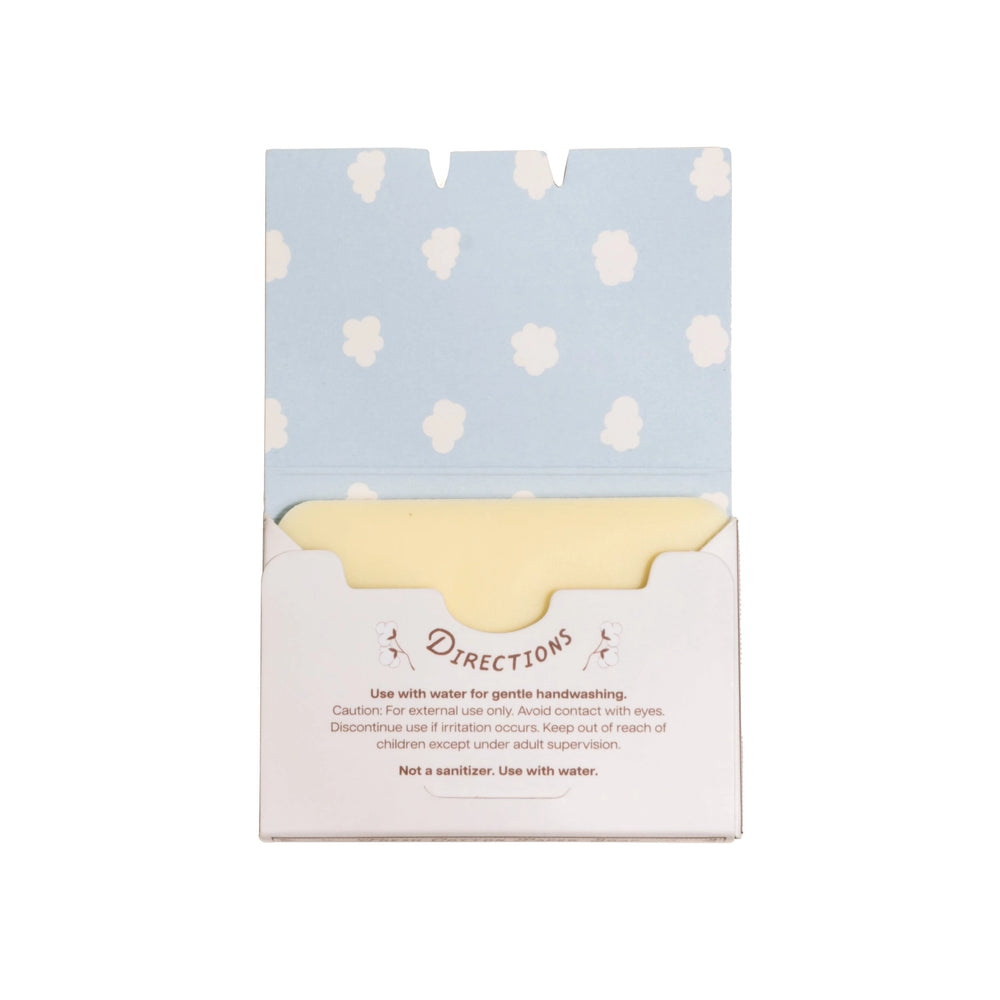 Packaged product with a light blue and white polka dot design on top and a white base with text.