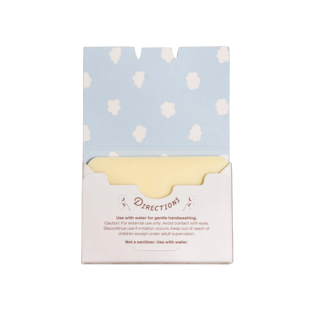 Packaged product with a light blue and white polka dot design on top and a white base with text.