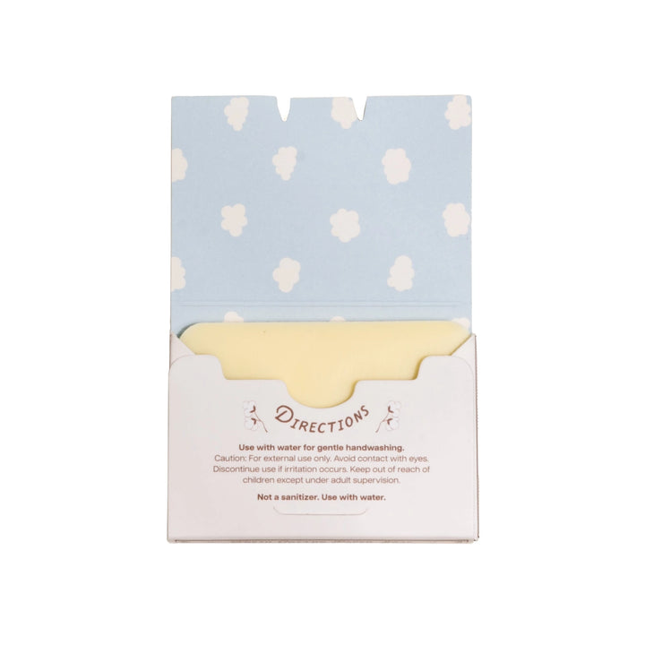 Packaged product with a light blue and white polka dot design on top and a white base with text.