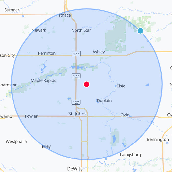 Radius map with a blue circle and red dot indicating a location near St. Johns, Michigan.