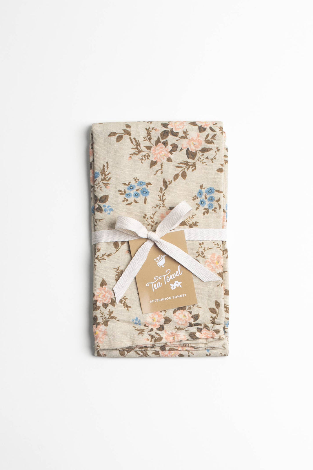 Floral-patterned product with a white ribbon and tag on a white background