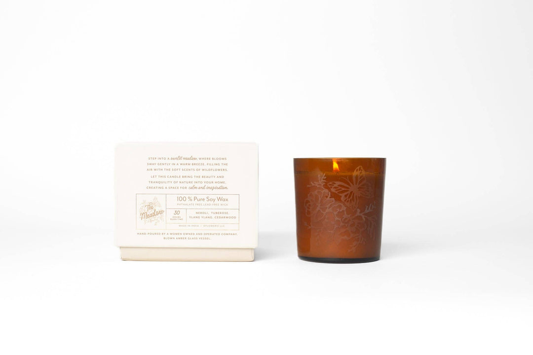 Brown glass candle with a white label on a white background
