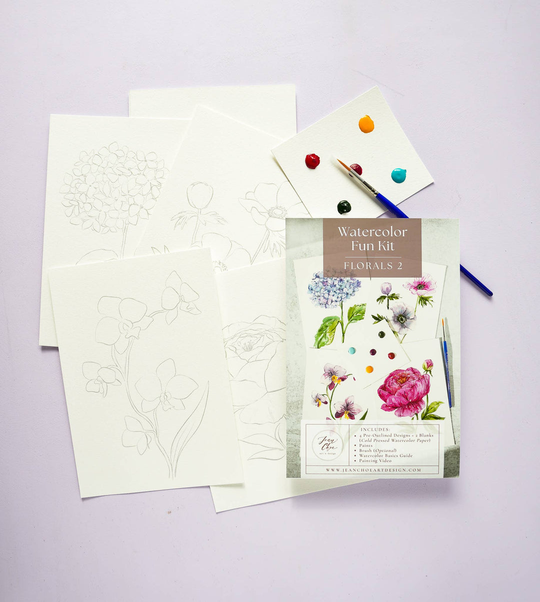 Watercolor fun kit with floral designs on a light purple background
