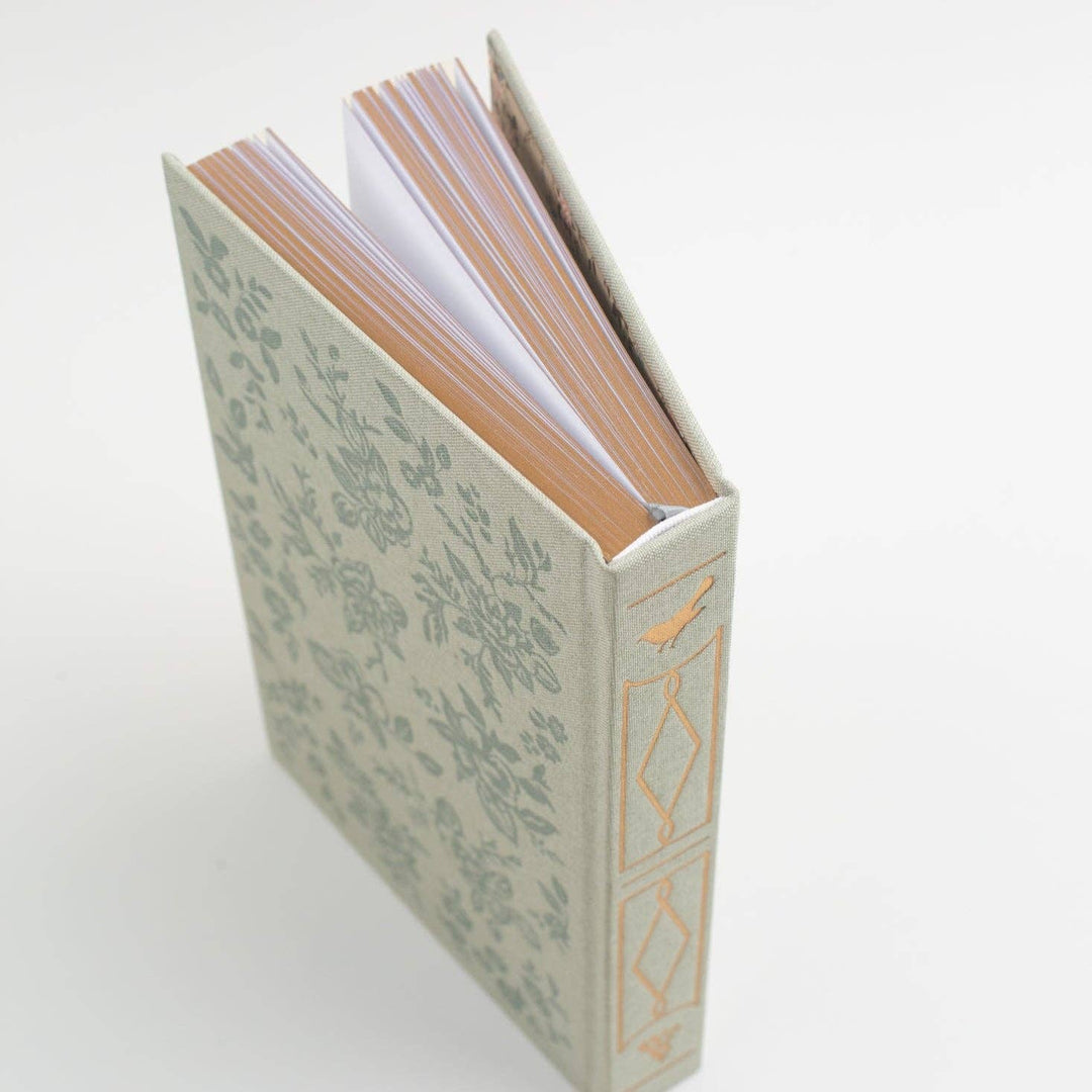 Decorative book with floral pattern on a white background